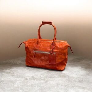 Dooney & Bourke Orange Embossed Travel bag
